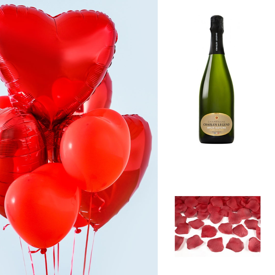 Bouquet de ballons coeur à l'hélium, bouteille de Champagne et pétales de rose